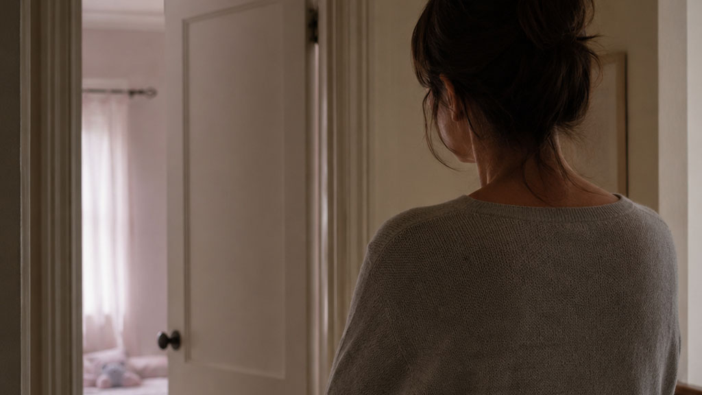 Parent in hallway outside child's bedroom during divorce separation in Texas